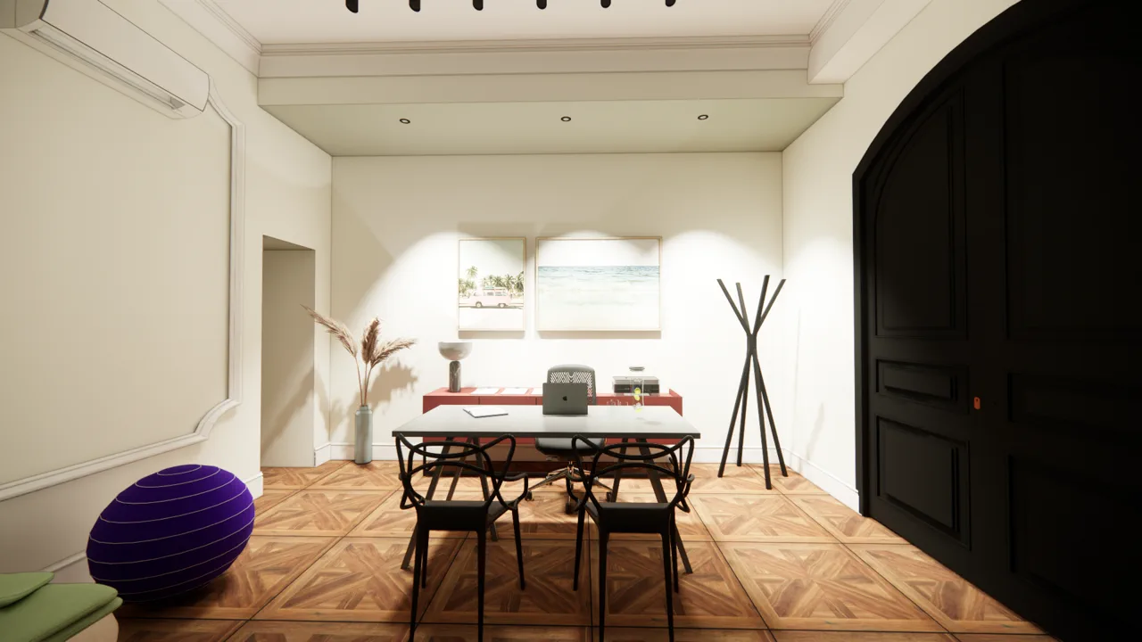 L'Atelier — bureau corail devant la grande porte cintrée sombre