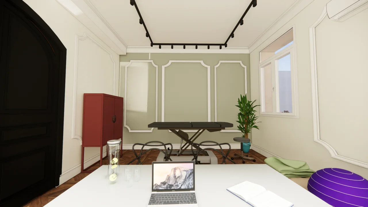 L'Atelier — mur vert sauge, meuble corail et table d'examen
