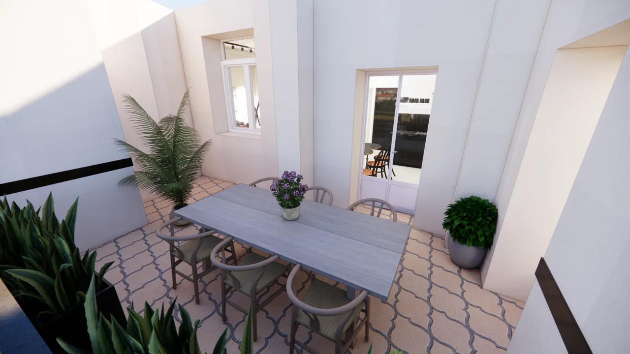 La terrasse privative — sol en carreaux à motifs, table et plantes en pot
